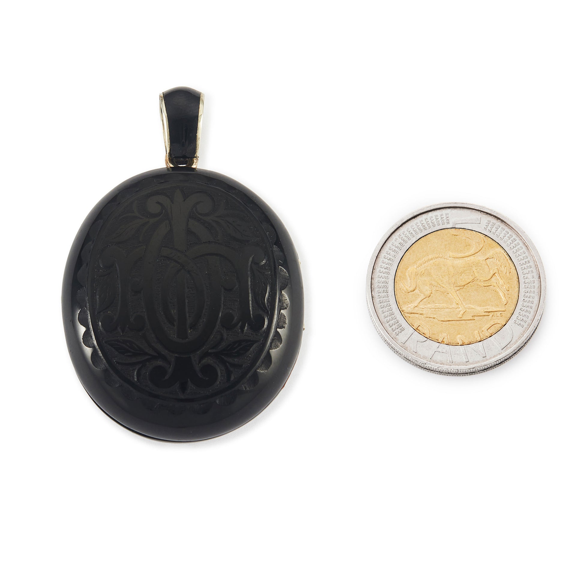 Exquisite Victorian jet monogrammed silver mourning locket which opens to a lock of hair behind glass, and space for a photograph. The bail has black enamelling.