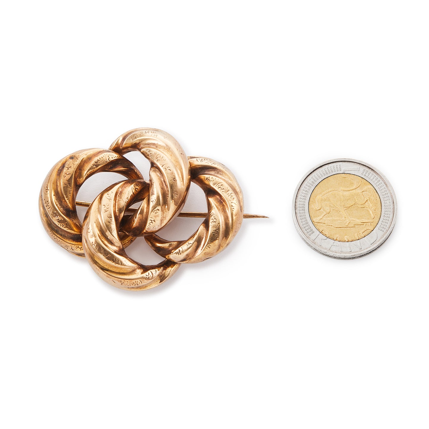 Classic Victorian pinchbeck love knot brooch with fine engraving. 