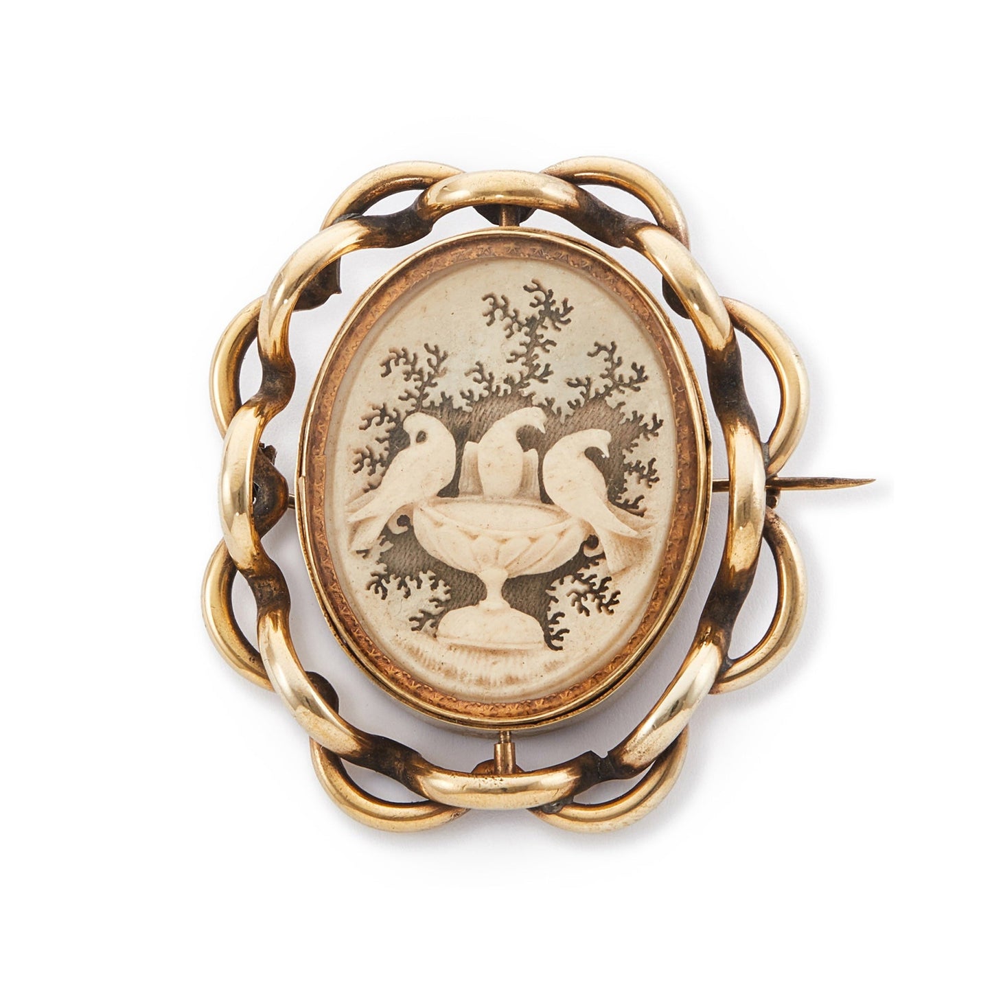 Unique Victorian pinchbeck swivel memorial brooch depicting three intricate doves perched on a bird bath carved from bone on one side. A hand-drawn image of the deceased is on the reverse side. Both artworks are behind glass.