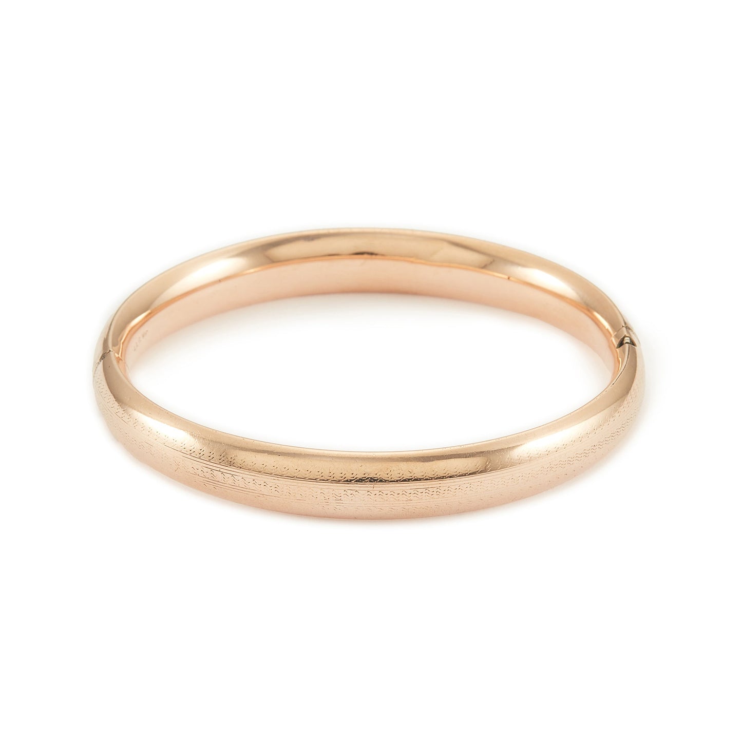 Stylish Victorian rose gold cased hollow bangle with faint engraving on one side.