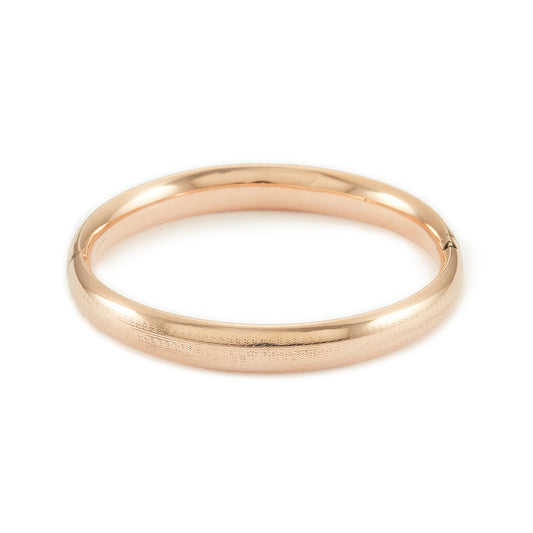 Stylish Victorian rose gold cased hollow bangle with faint engraving on one side.