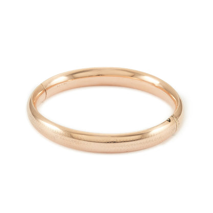 Stylish Victorian rose gold cased hollow bangle with faint engraving on one side.