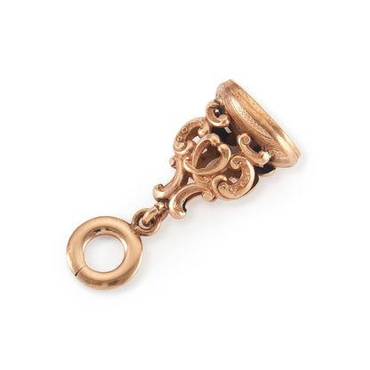 Quaint Victorian rose gold cased fob with intricate repoussé detail.