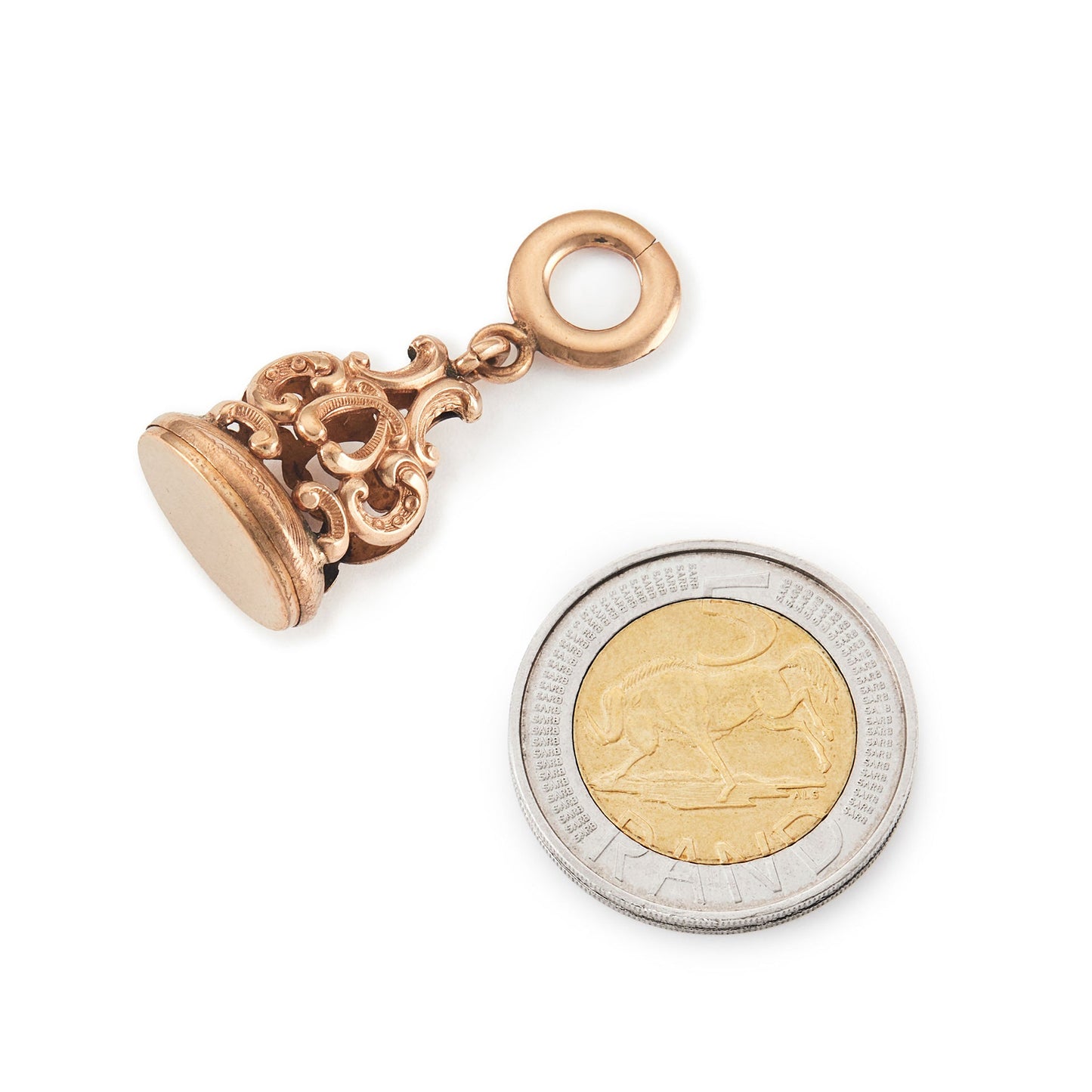 Quaint Victorian rose gold cased fob with intricate repoussé detail.
