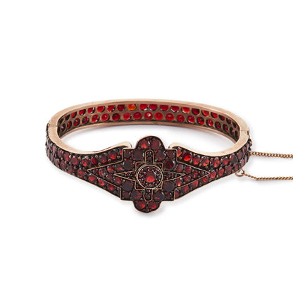 Magnificent Victorian rose gold plated Bohemian garnet bangle centred with a star design.