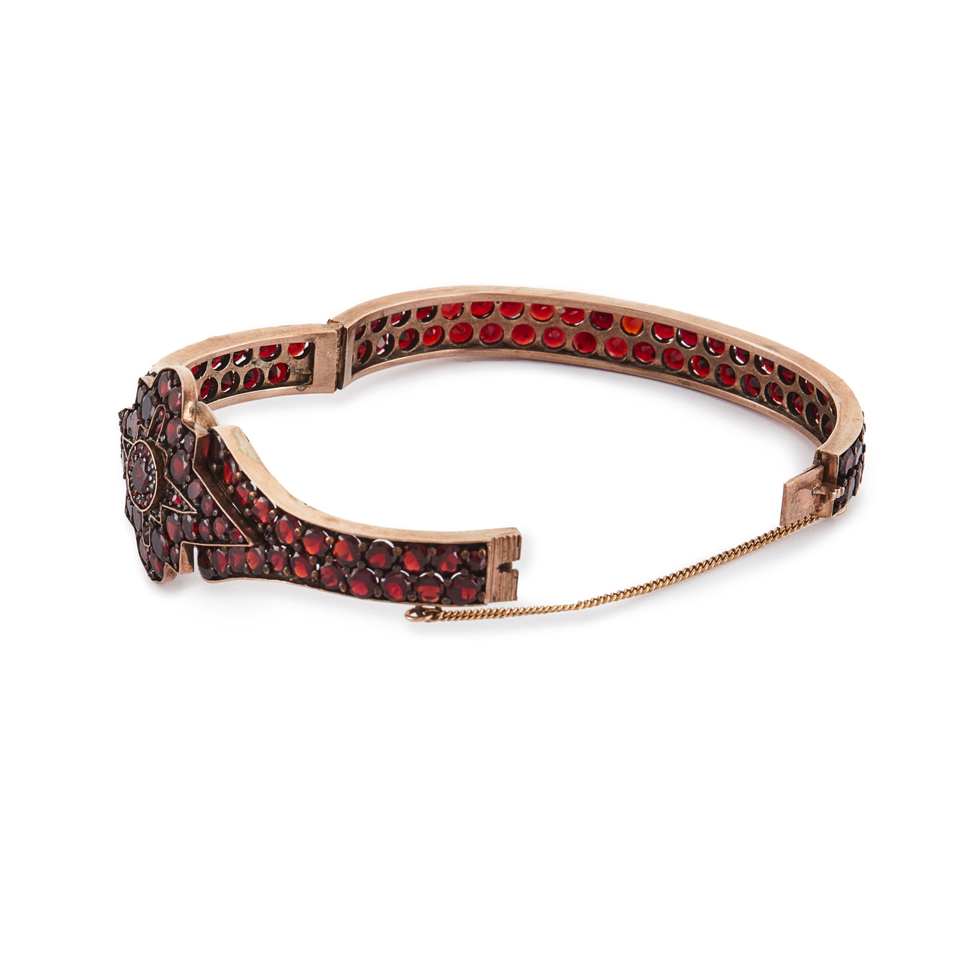 Magnificent Victorian rose gold plated Bohemian garnet bangle centred with a star design.