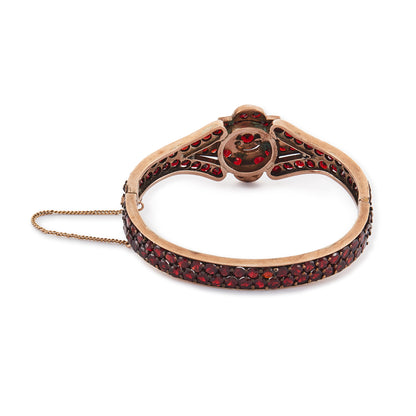 Magnificent Victorian rose gold plated Bohemian garnet bangle centred with a star design.