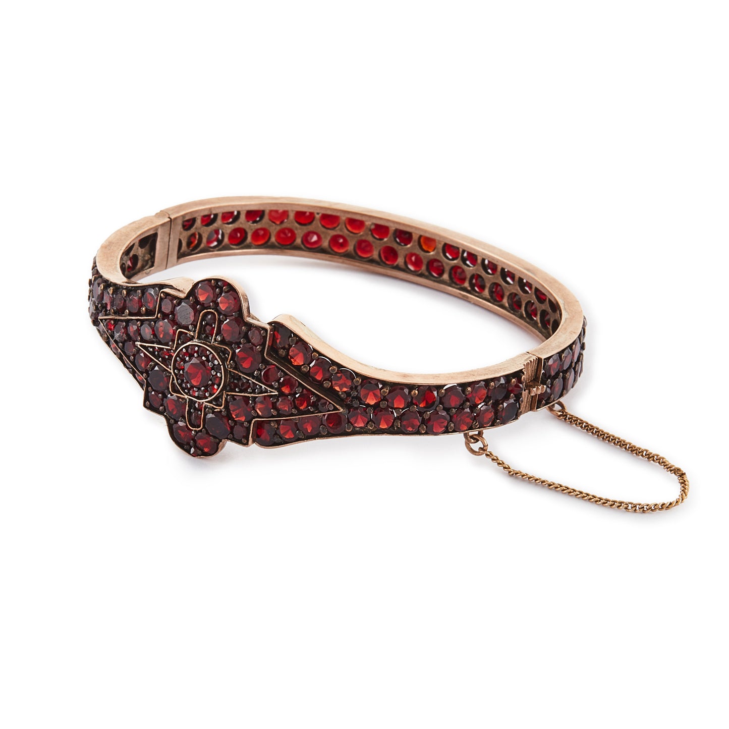 Magnificent Victorian rose gold plated Bohemian garnet bangle centred with a star design.
