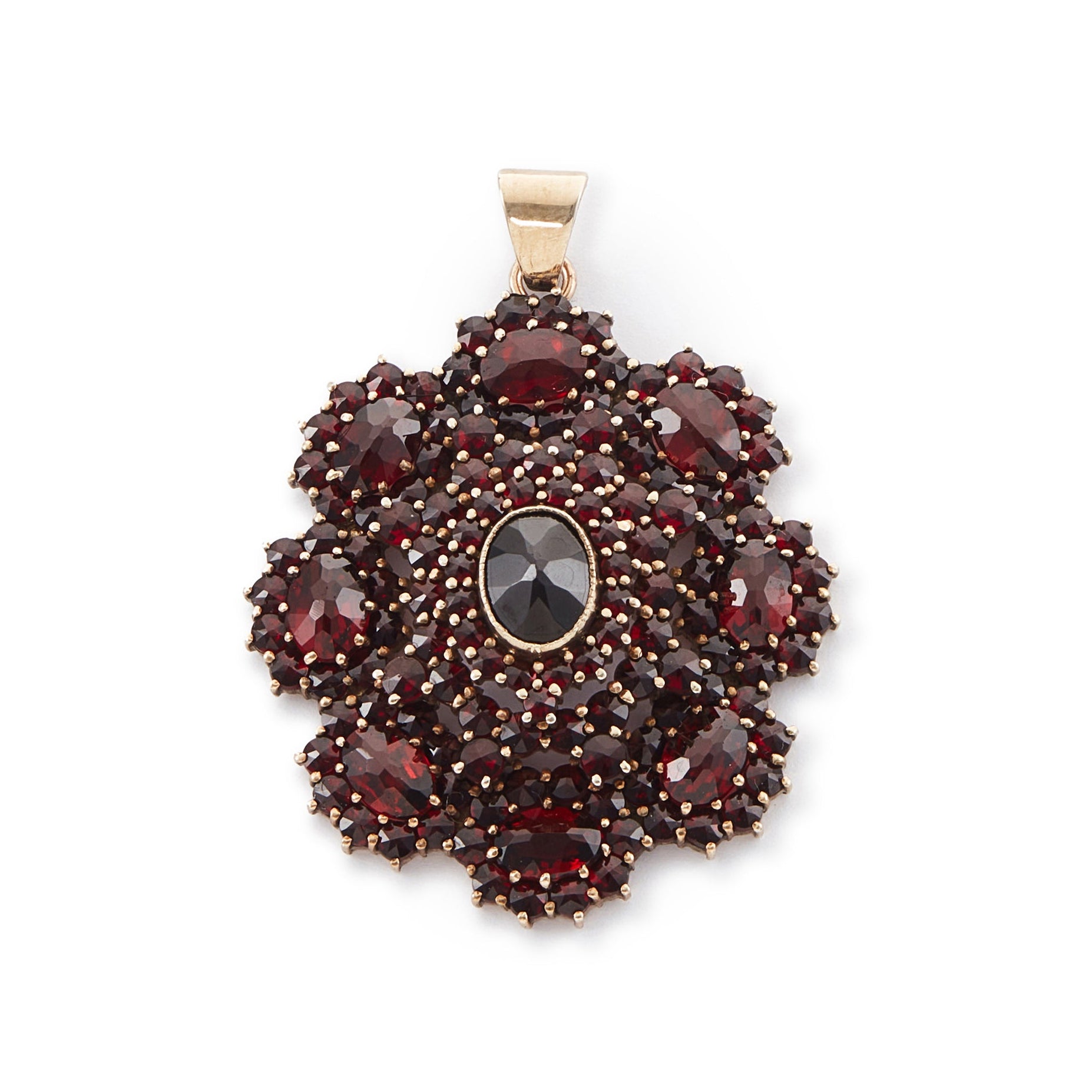 Impressive silver-gilt Victorian pendant set with a variety of beautifully faceted Bohemian garnets in four tiers.