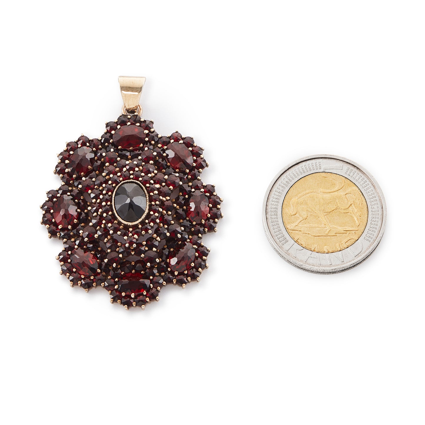 Impressive silver-gilt Victorian pendant set with a variety of beautifully faceted Bohemian garnets in four tiers.