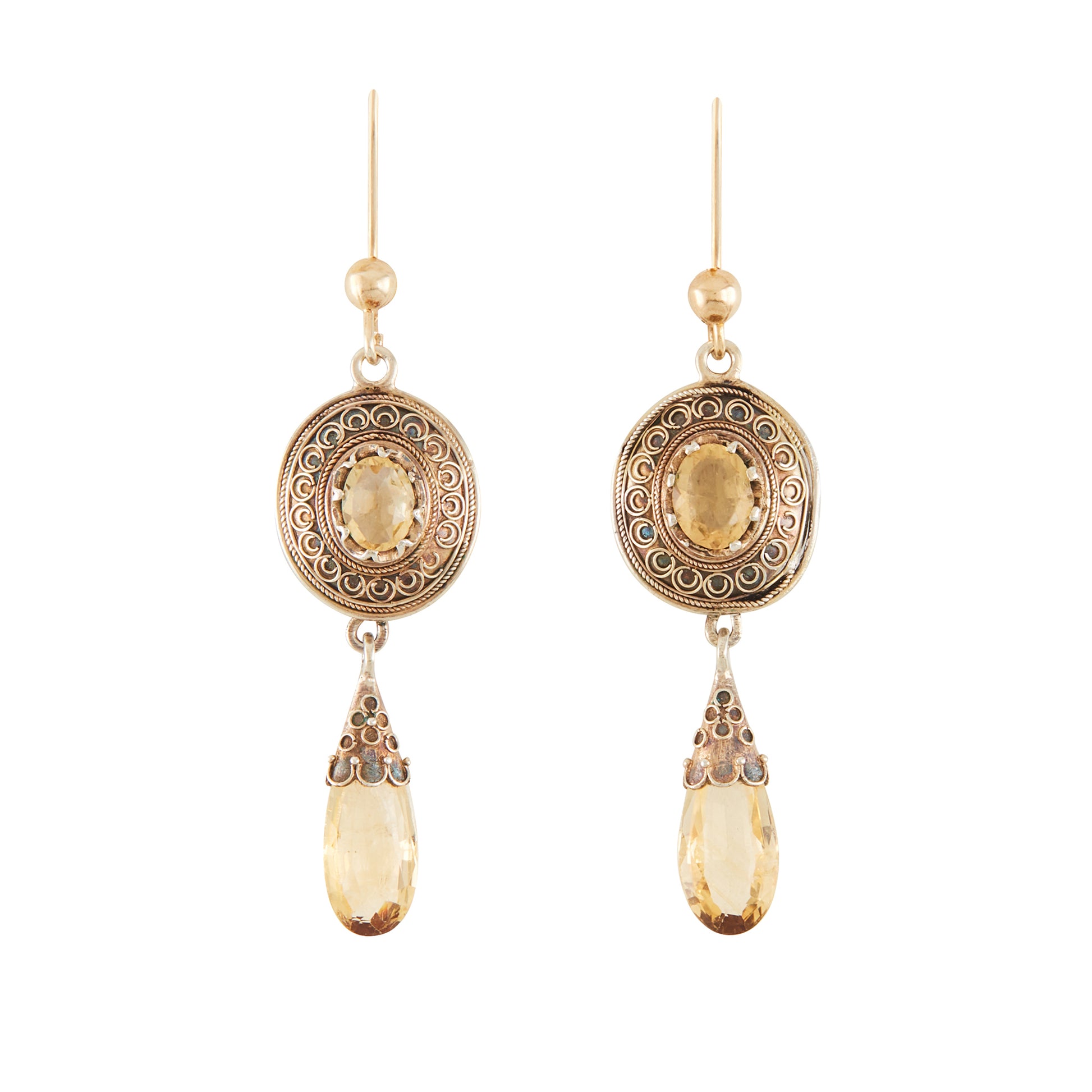 Gorgeous Victorian silver-gilt earrings, each set with a beautifully faceted citrine and a dangling citrine drop. The earrings feature beautiful scroll work detail on the metal.