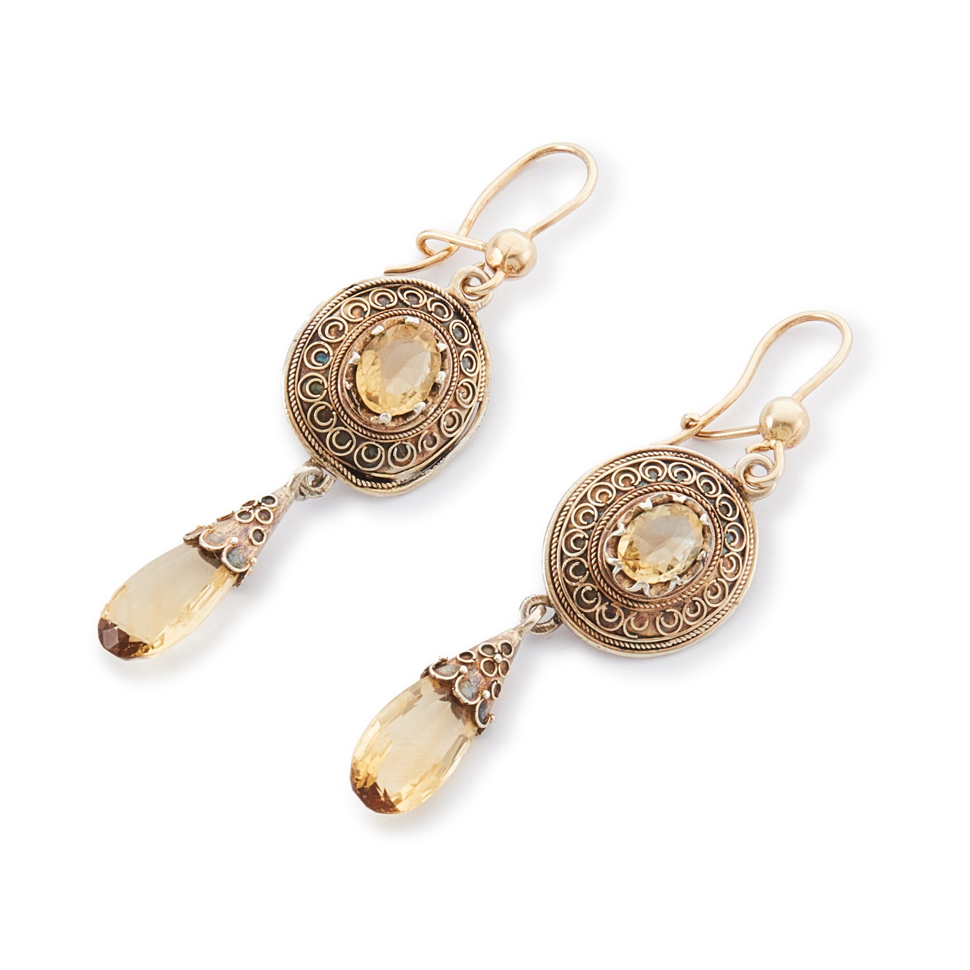 Gorgeous Victorian silver-gilt earrings, each set with a beautifully faceted citrine and a dangling citrine drop. The earrings feature beautiful scroll work detail on the metal.