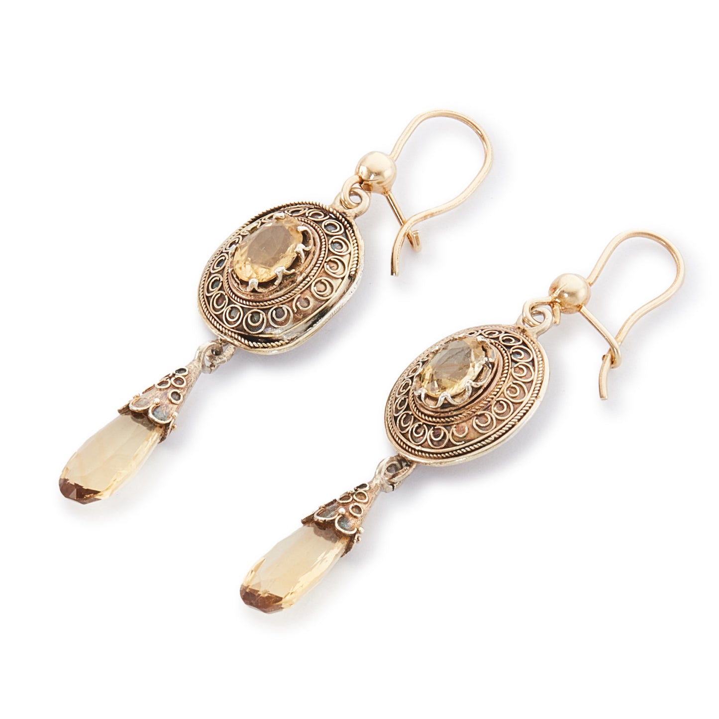 Gorgeous Victorian silver-gilt earrings, each set with a beautifully faceted citrine and a dangling citrine drop. The earrings feature beautiful scroll work detail on the metal.