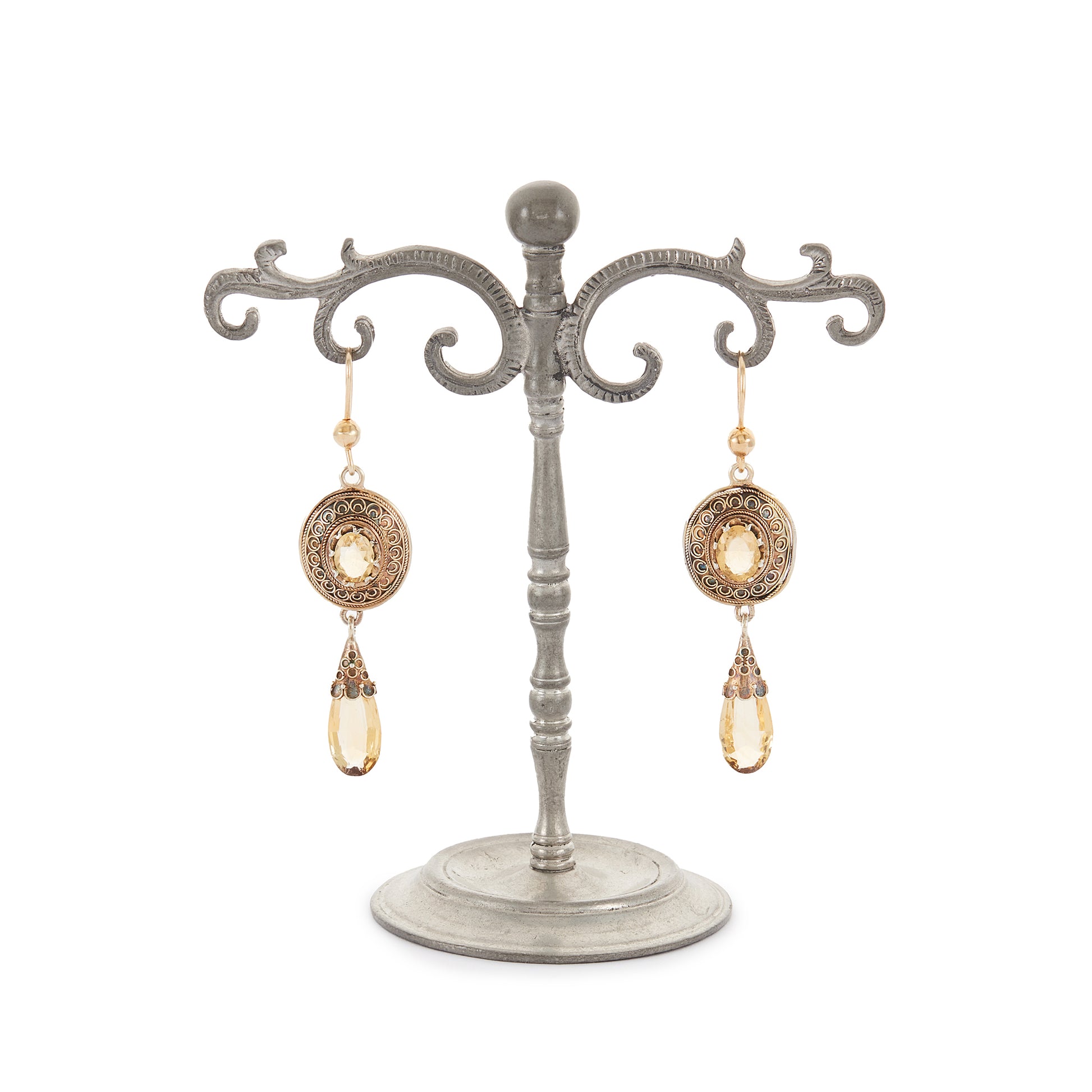 Gorgeous Victorian silver-gilt earrings, each set with a beautifully faceted citrine and a dangling citrine drop. The earrings feature beautiful scroll work detail on the metal.