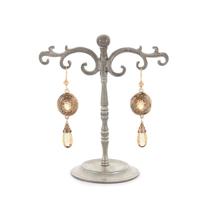 Gorgeous Victorian silver-gilt earrings, each set with a beautifully faceted citrine and a dangling citrine drop. The earrings feature beautiful scroll work detail on the metal.