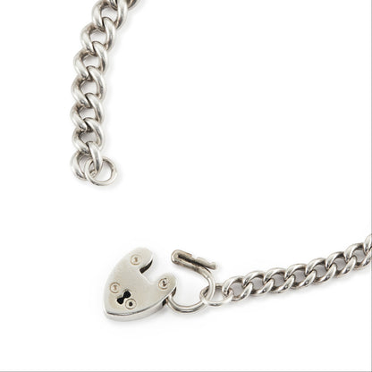 Classic silver Victorian curb link bracelet with solid, graduated links and a padlock. Every link is stamped.