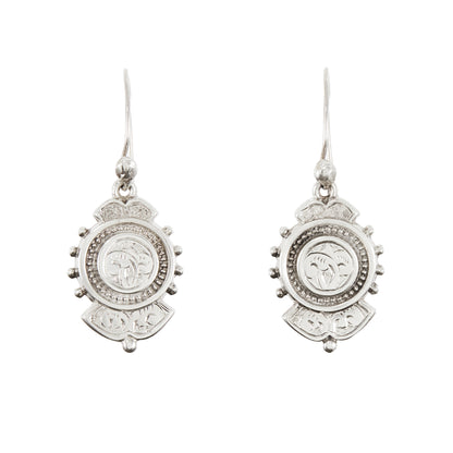 Beautifully engraved silver Victorian dangling earrings with shepherd's hooks, accompanied by a brooch with the same design. 