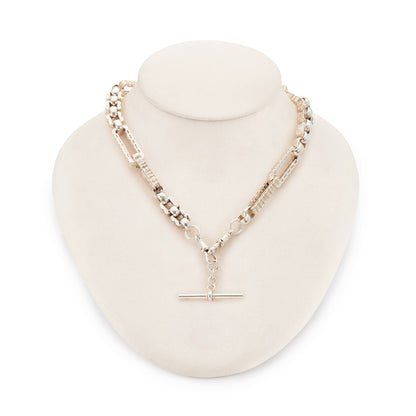 Stylish silver Victorian fob chain consisting of large, hollow, fancy links as well as two dog-clips and a t-bar.