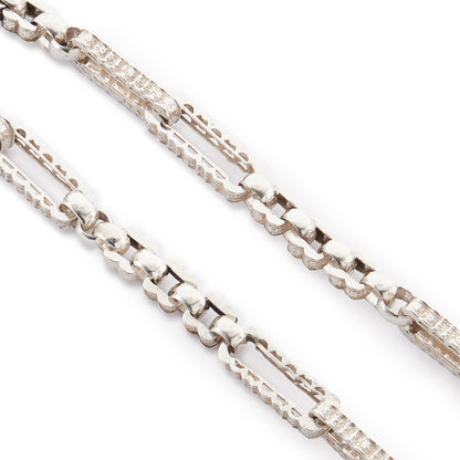 Stylish silver Victorian fob chain consisting of large, hollow, fancy links as well as two dog-clips and a t-bar.