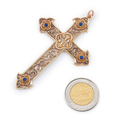 Ornately carved silver-gilt Victorian monogrammed cross pendant set with four lapis lazuli cabochon stones.