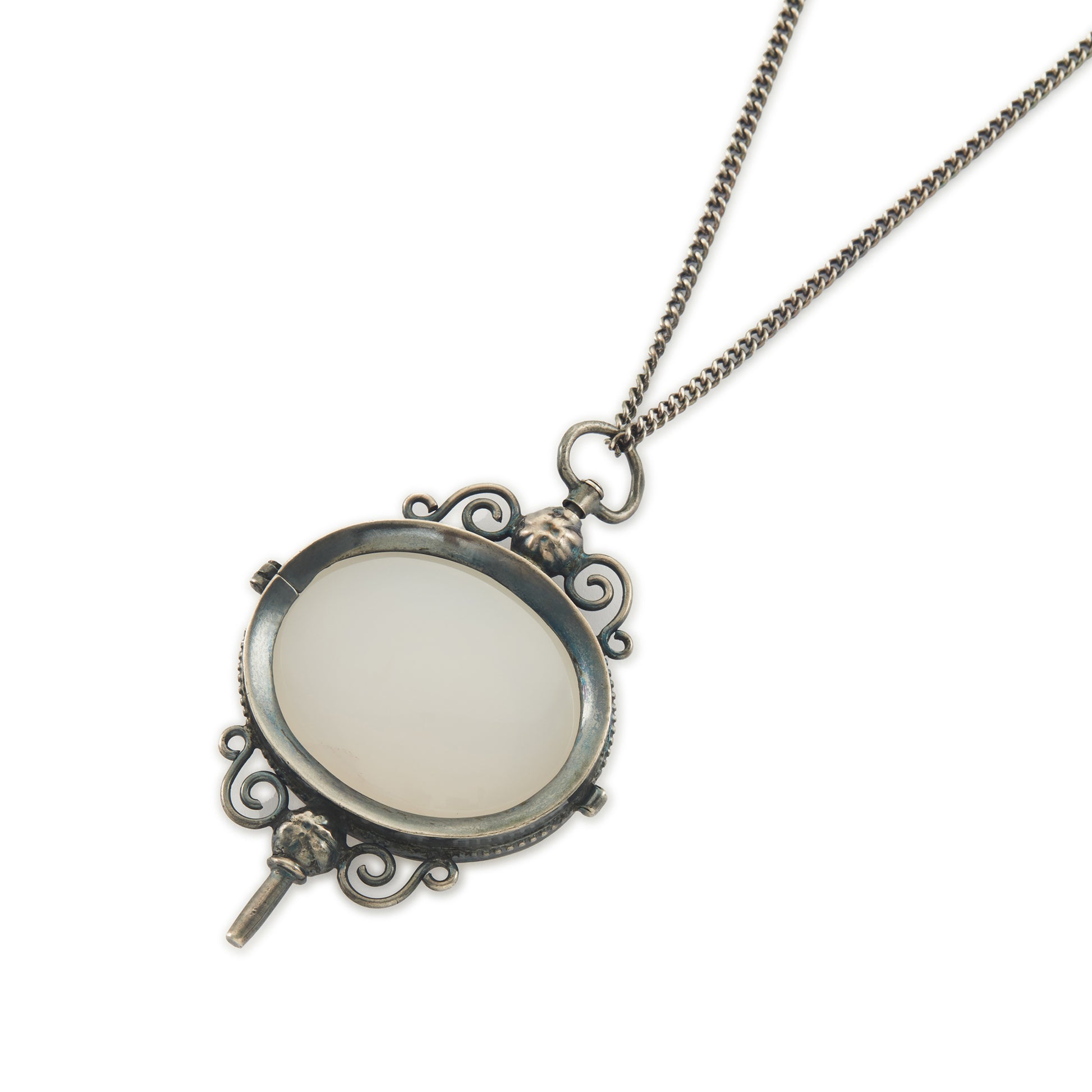 Charming Victorian oxidised silver and agate key winder pendant on a long chain.