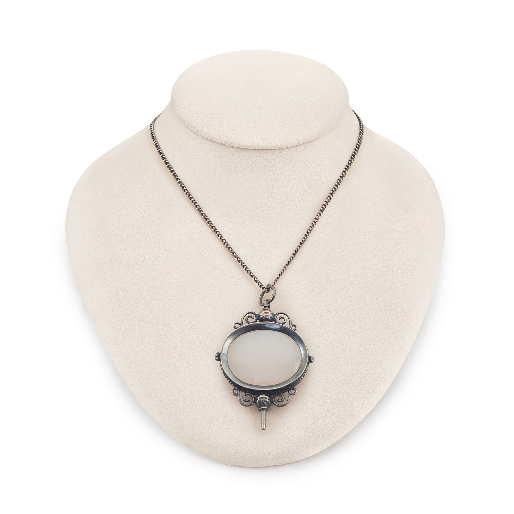 Charming Victorian oxidised silver and agate key winder pendant on a long chain.