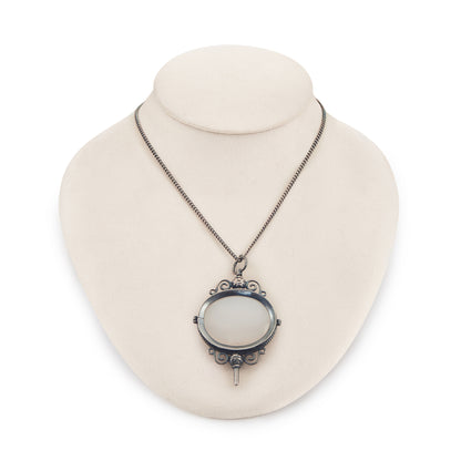 Charming Victorian oxidised silver and agate key winder pendant on a long chain.