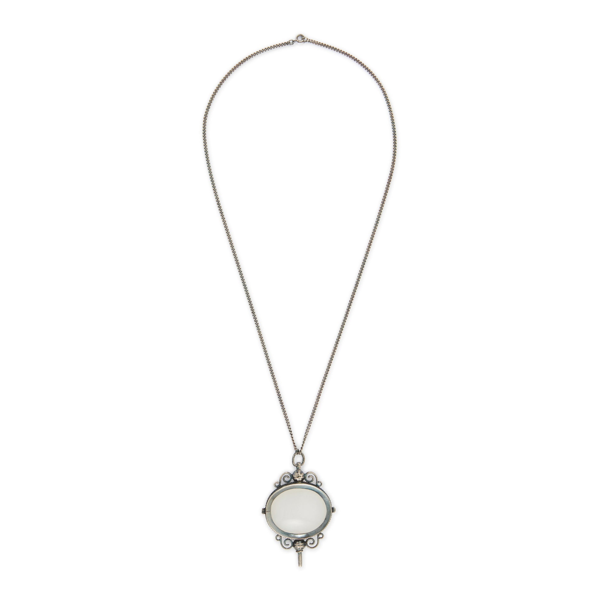 Charming Victorian oxidised silver and agate key winder pendant on a long chain.