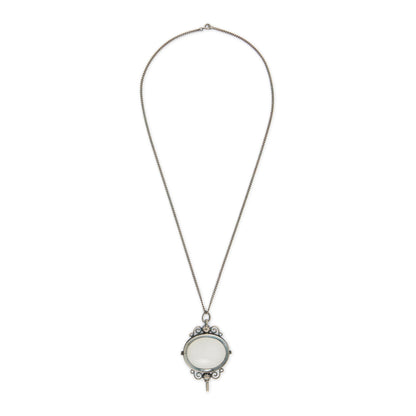 Charming Victorian oxidised silver and agate key winder pendant on a long chain.