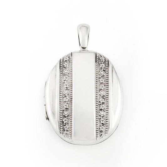 Beautiful Victorian silver locket embossed with intricate flower motifs on both sides. The locket can take two photographs.