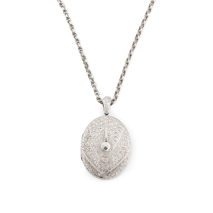 Beautifully engraved Victorian silver locket on an ornate silver chain with a barrel clasp.