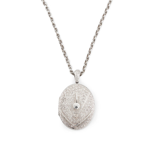 Beautifully engraved Victorian silver locket on an ornate silver chain with a barrel clasp.