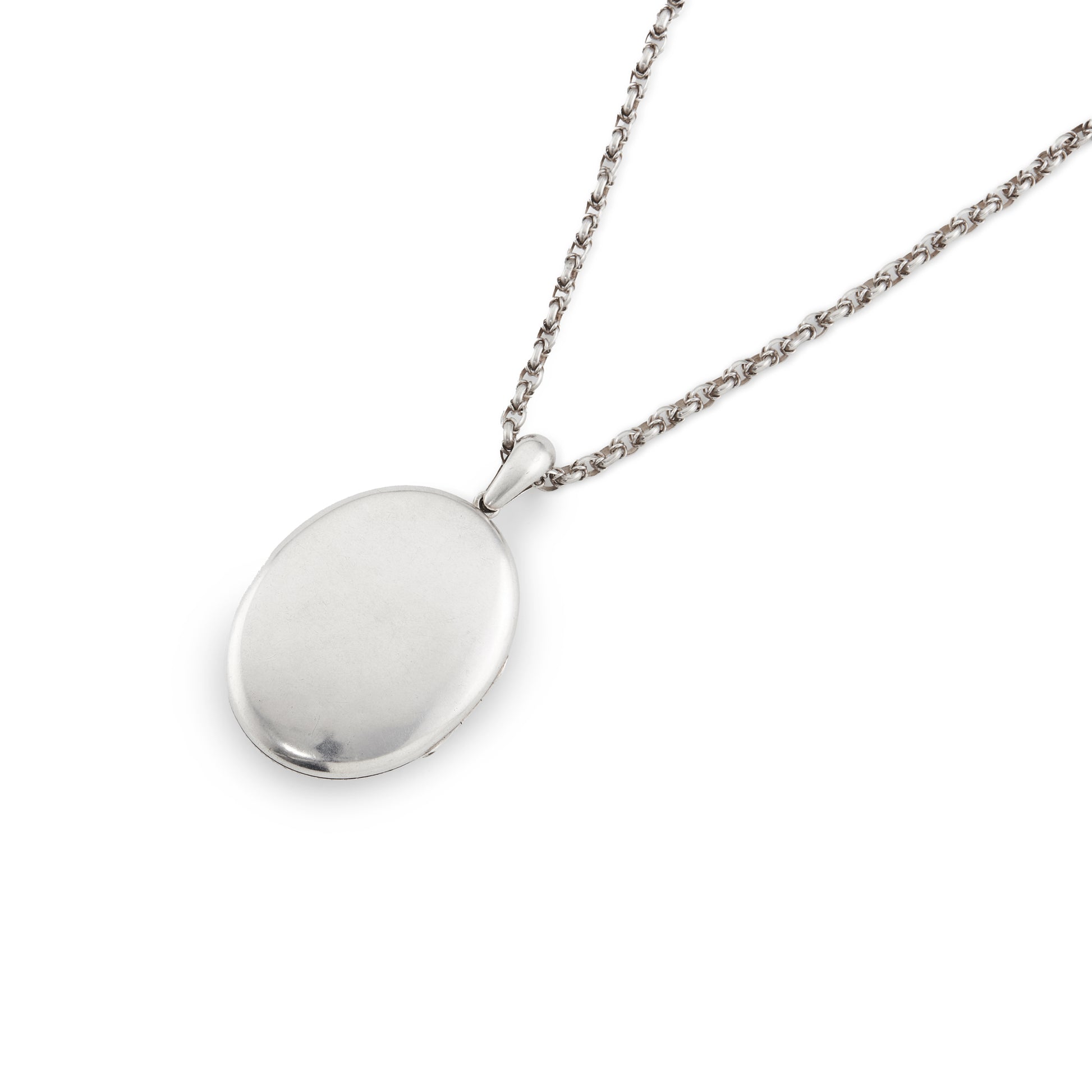 Beautifully engraved Victorian silver locket on an ornate silver chain with a barrel clasp.