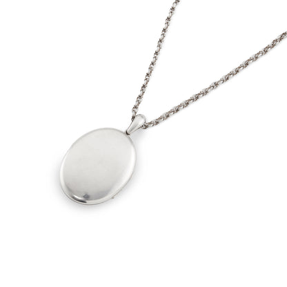 Beautifully engraved Victorian silver locket on an ornate silver chain with a barrel clasp.