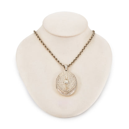 Beautifully engraved Victorian silver locket on an ornate silver chain with a barrel clasp.