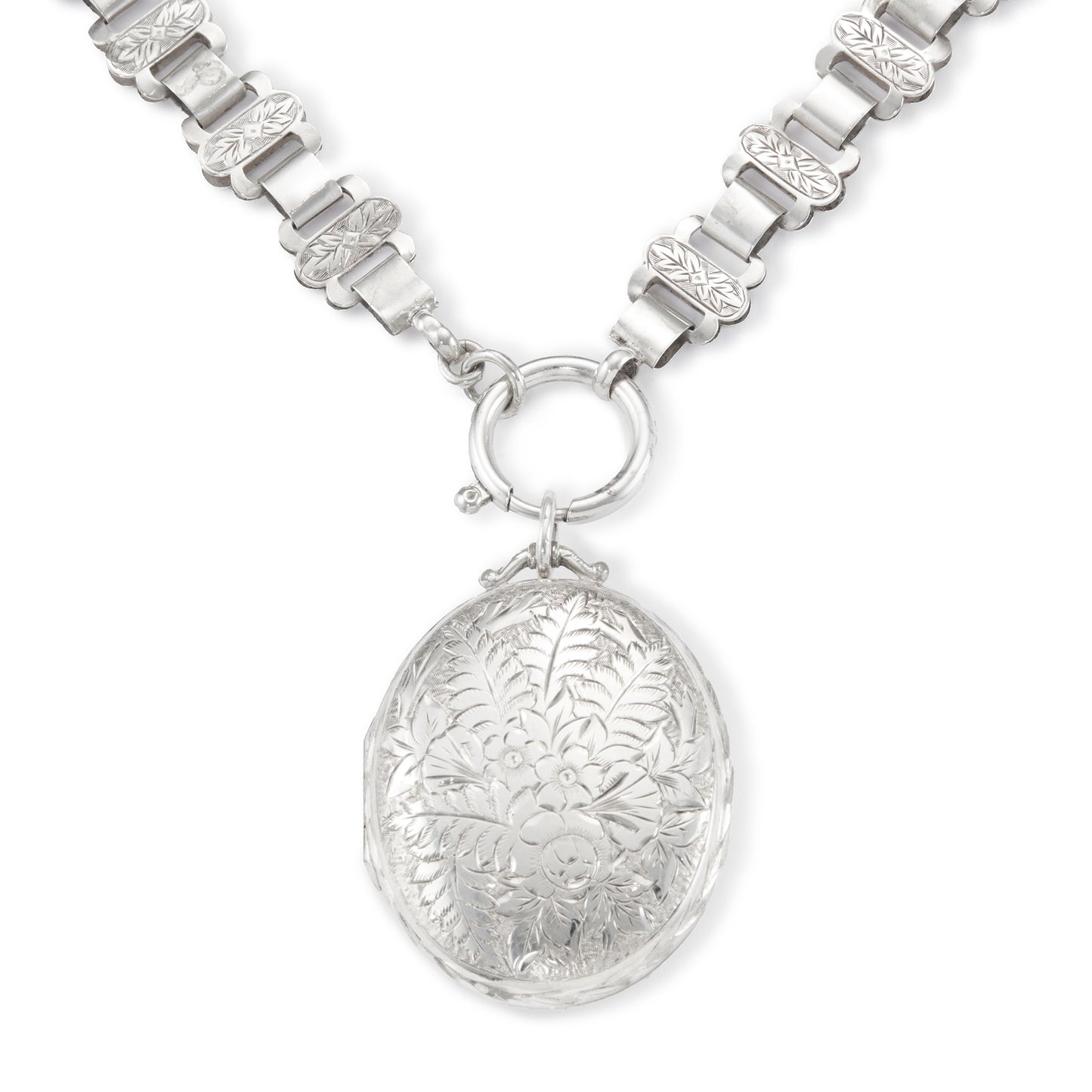 Classic Victorian silver locket on choker with ornate floral engraving.