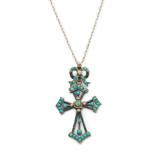 Exquisite Victorian silver enamelled turquoise cross and bow pendant set with five seed pearls, dangling from a long and intricate chain.