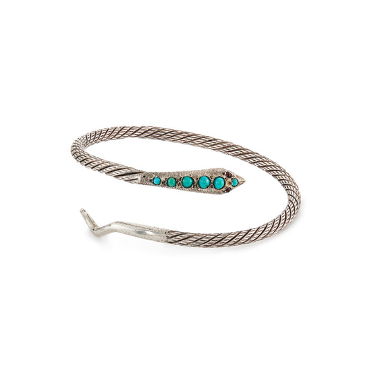 Charming Victorian oxidised silver serpent bangle with a rope design. Set with six cabochon turquoise stones and garnet eyes.