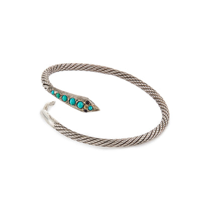 Charming Victorian oxidised silver serpent bangle with a rope design. Set with six cabochon turquoise stones and garnet eyes.