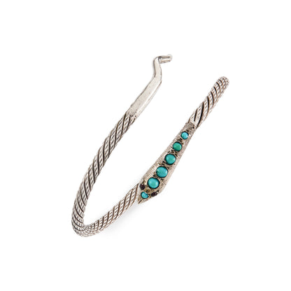 Charming Victorian oxidised silver serpent bangle with a rope design. Set with six cabochon turquoise stones and garnet eyes.