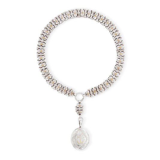 Stunning sterling silver Victorian locket on choker. Both the locket and choker are beautifully engraved with ornate gold detail. Locket takes two photographs and has one oval piece of glass on the inside of the frame. 