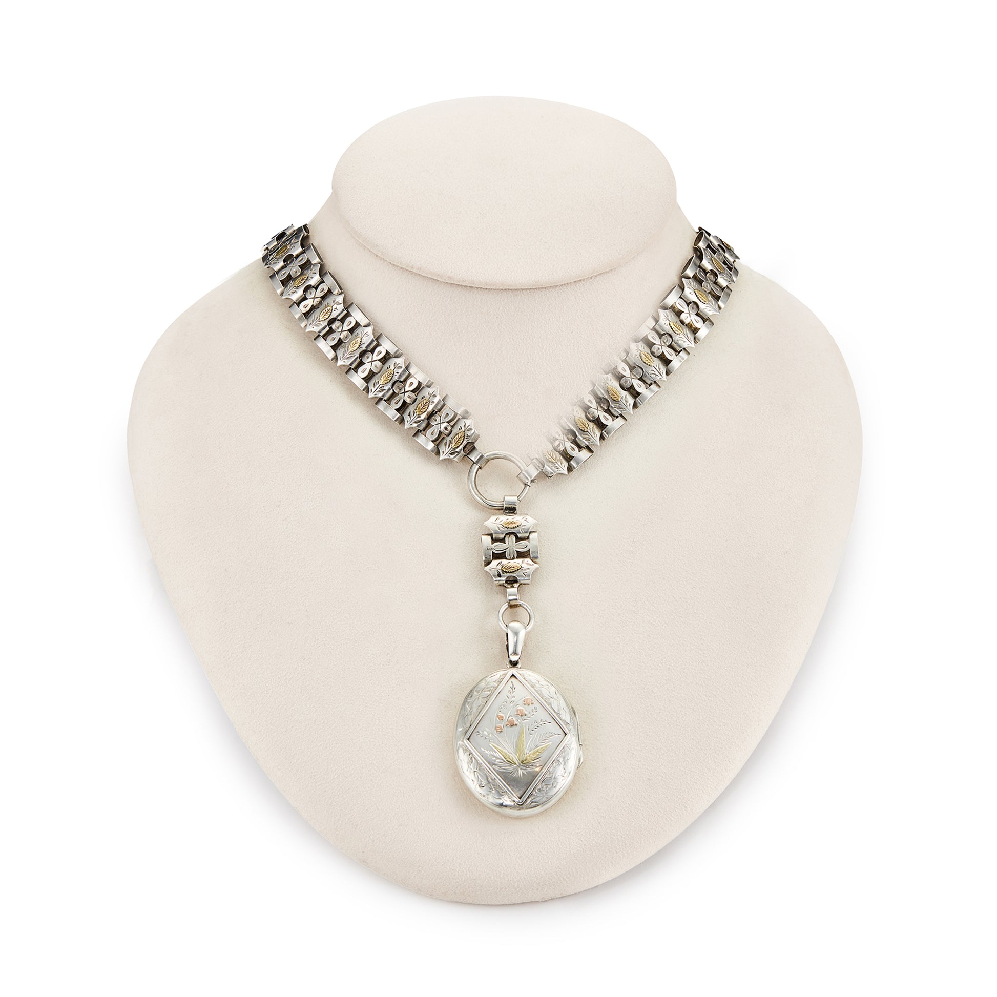 Stunning sterling silver Victorian locket on choker. Both the locket and choker are beautifully engraved with ornate gold detail. Locket takes two photographs and has one oval piece of glass on the inside of the frame. 