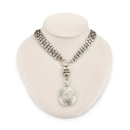 Stunning sterling silver Victorian locket on choker. Both the locket and choker are beautifully engraved with ornate gold detail. Locket takes two photographs and has one oval piece of glass on the inside of the frame. 