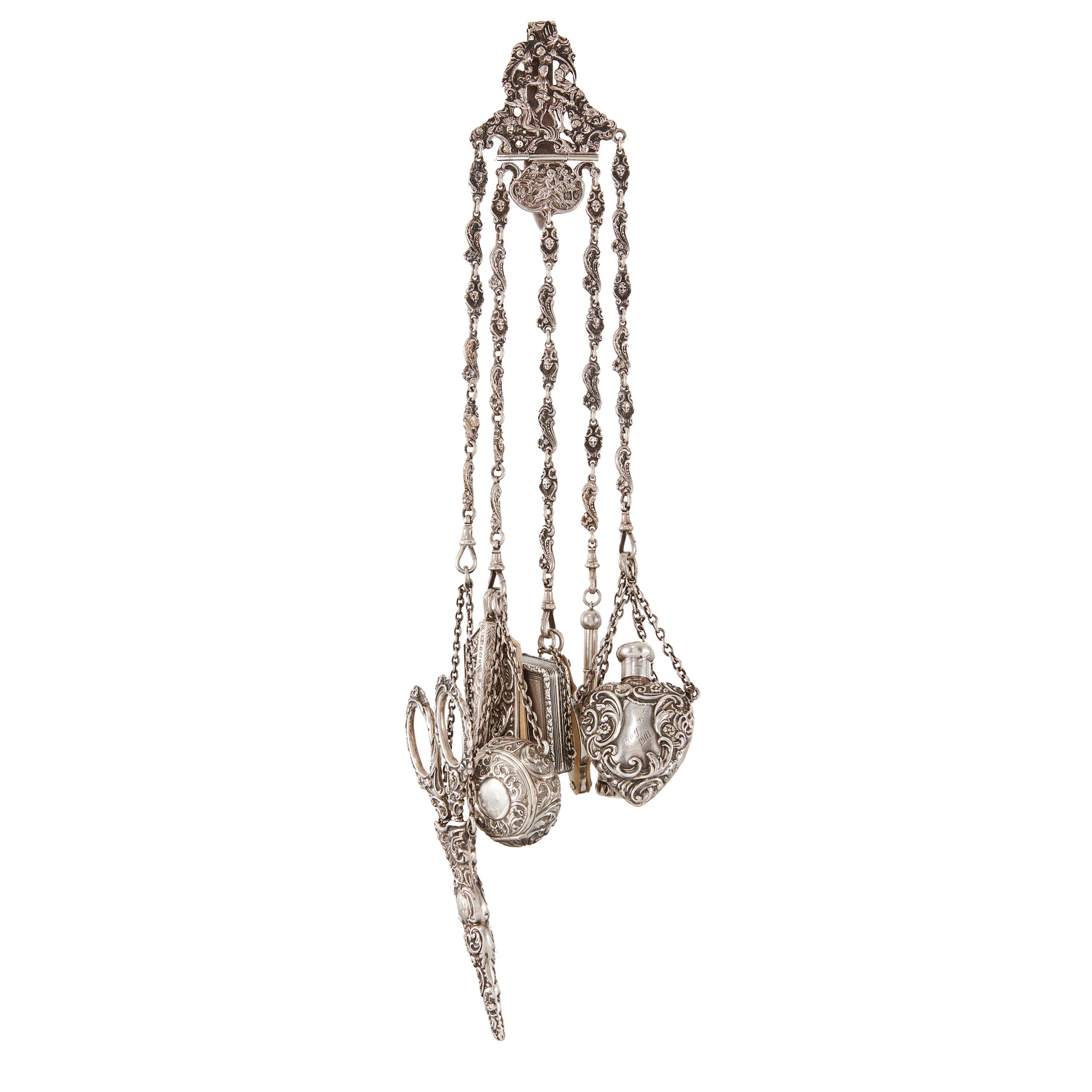 Magnificent Victorian sterling silver chatelaine with household tools dangling from chains with dog clips. The decorative belt hook holds a of a pair of scissors, a pencil, a pill box, a miniature note pad, a lorgnette with mother of pearl casing, a beautiful vinaigrette with silver-gilt inside, a shoe hook, a perfume bottle and a thimble holder with a thimble inside.