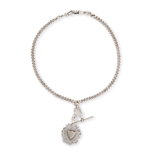 Classic Victorian sterling silver curb-link fob chain with an ornate medallion, a t-bar and two dog-clips.