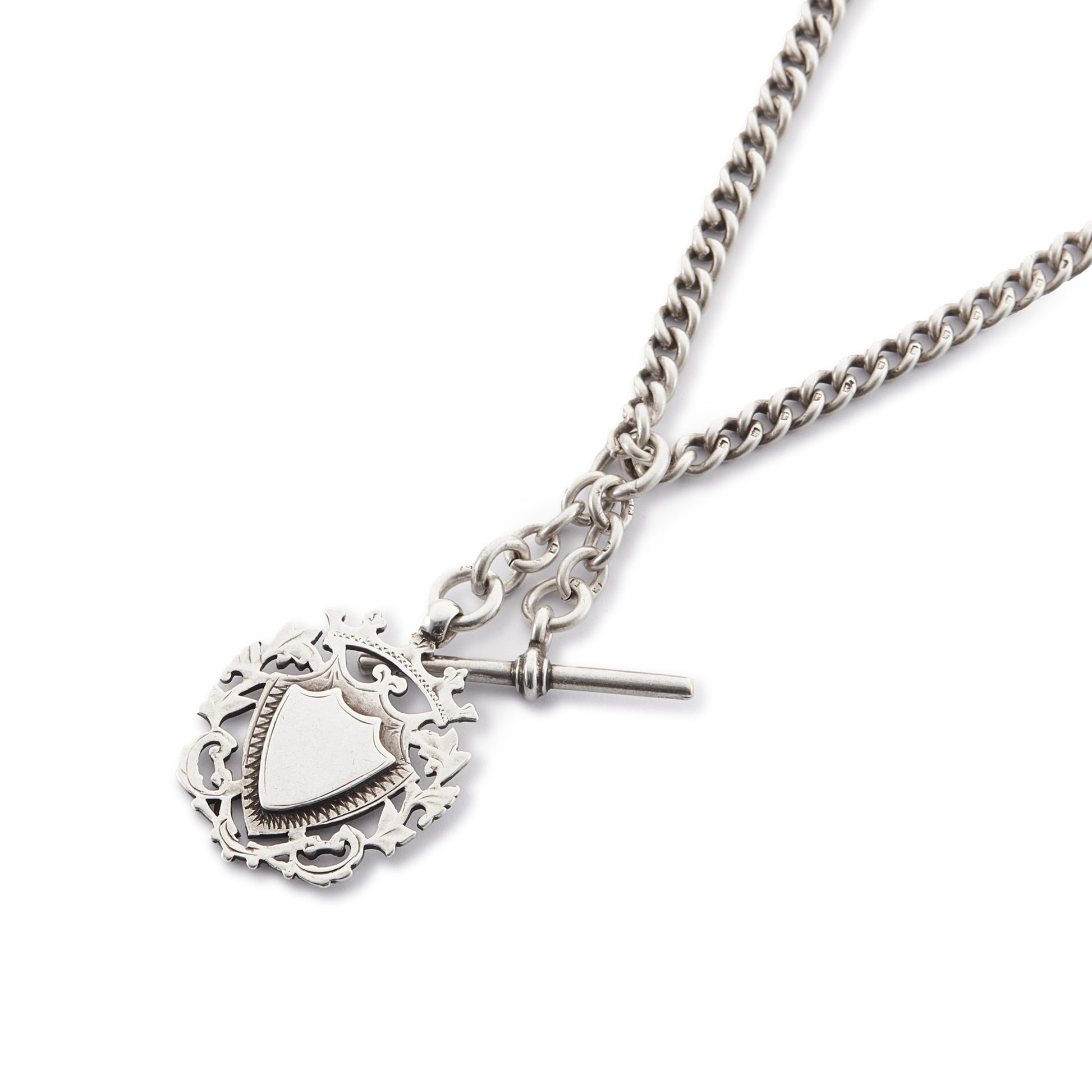 Classic Victorian sterling silver curb-link fob chain with an ornate medallion, a t-bar and two dog-clips.