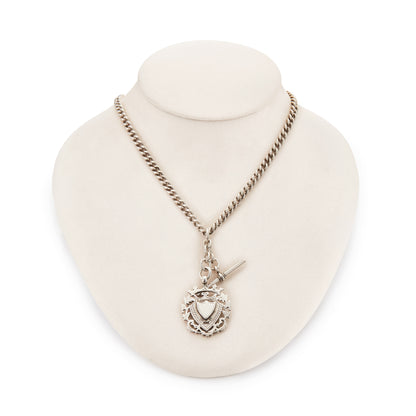 Classic Victorian sterling silver curb-link fob chain with an ornate medallion, a t-bar and two dog-clips.