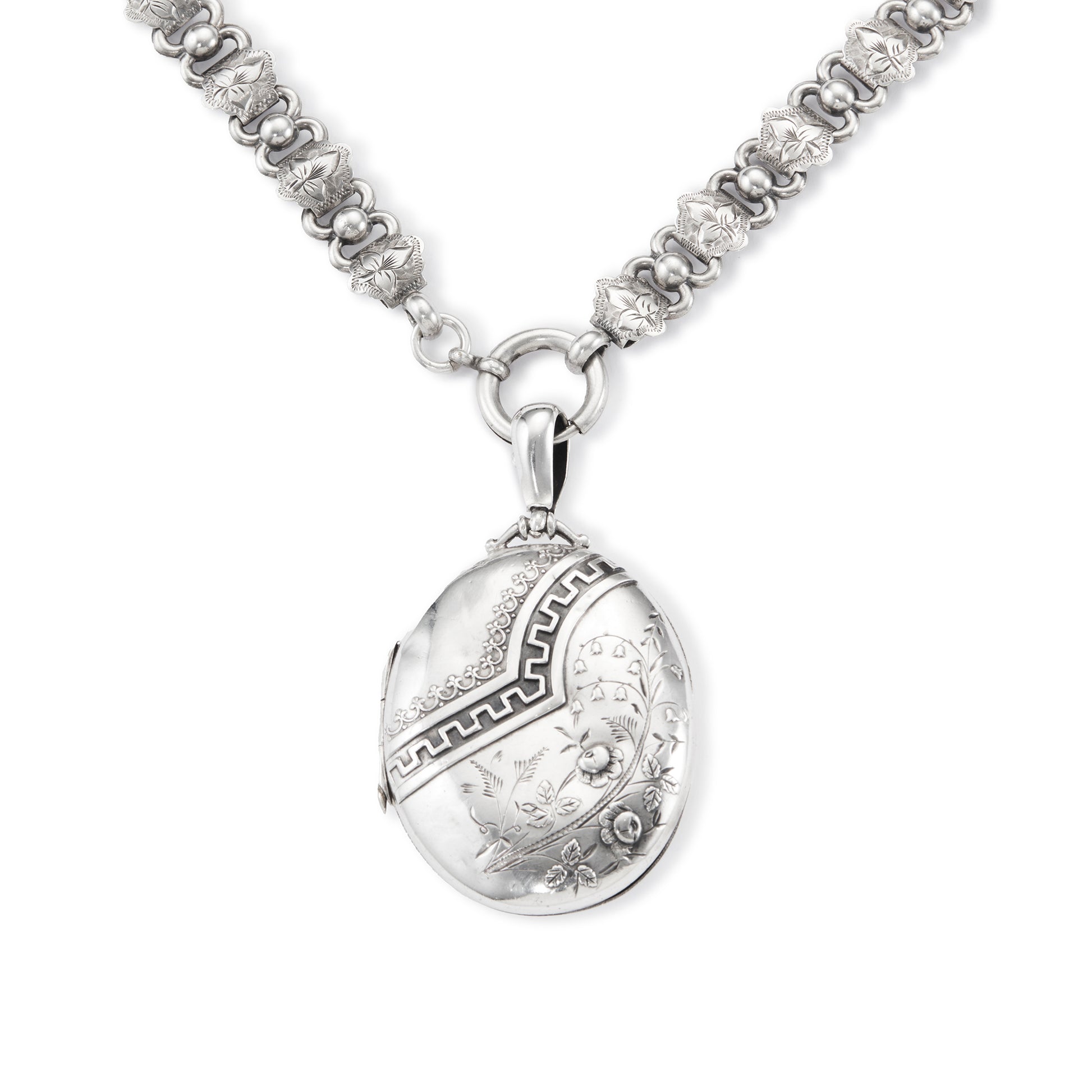 Beautiful Victorian sterling silver locket with intricate detail on an ornate sterling silver chain. Faint inscription at the back of the locket.