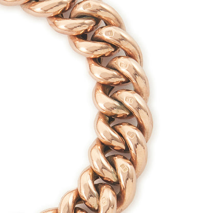 Classic Victorian 9ct rose gold curb link bracelet with a padlock and safety chain. The bracelet is plain on one side and with ornate engraving on the reverse side.