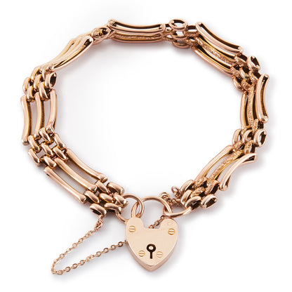 Stylish Victorian 9ct rose gold gateleg bracelet with a padlock and safety chain. Fine engraving on one side.